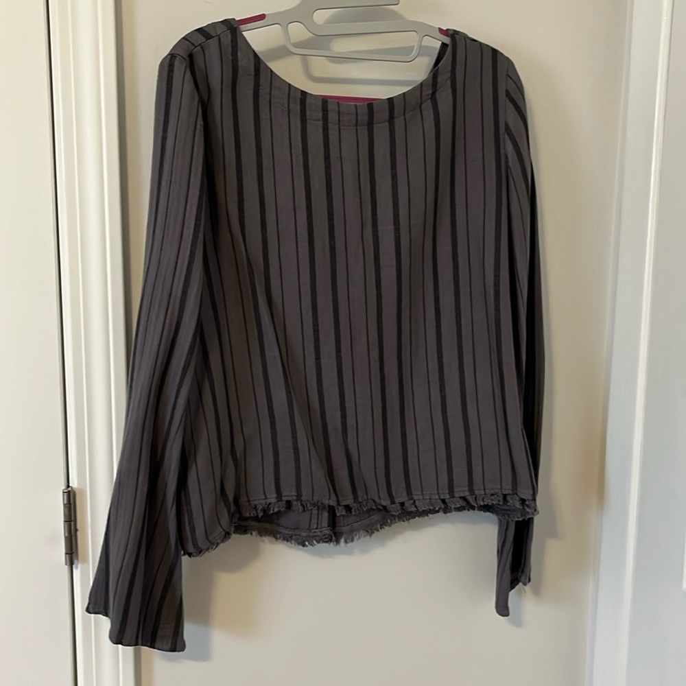 Cloth and stone stripped long sleeve with button going down the back in size M